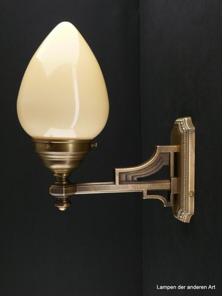 Wandlampe aus massivem Messingguss goldbraun patiniert mit elfenbeinfarbenen Schirm 1xE27/40W